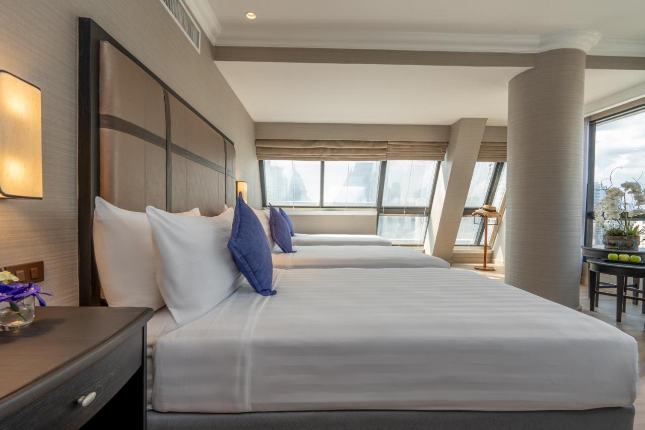 Nh Bangkok Sukhumvit Boulevard Buitenkant foto A bedroom at the hotel
